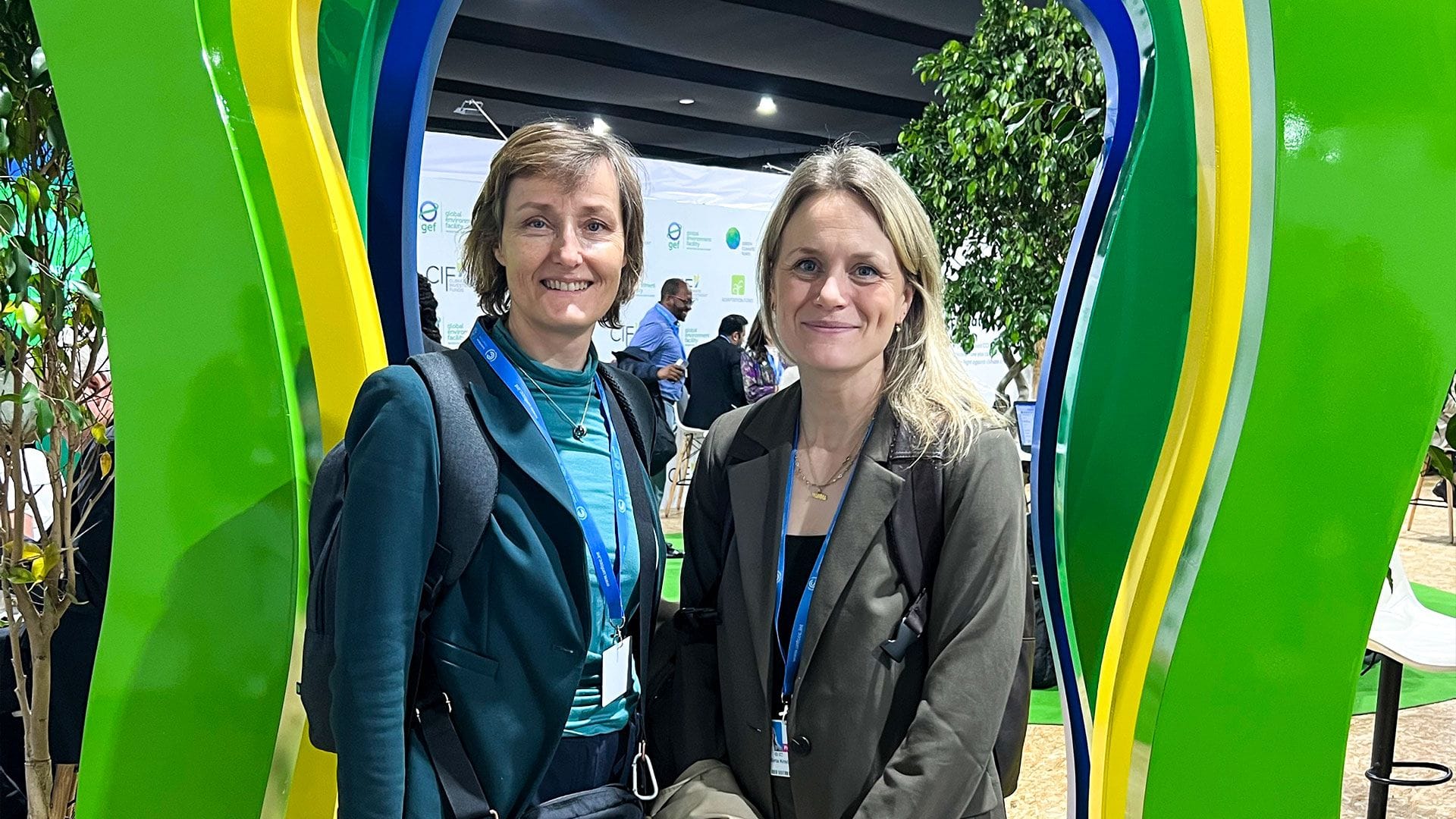 Two women at a conference.